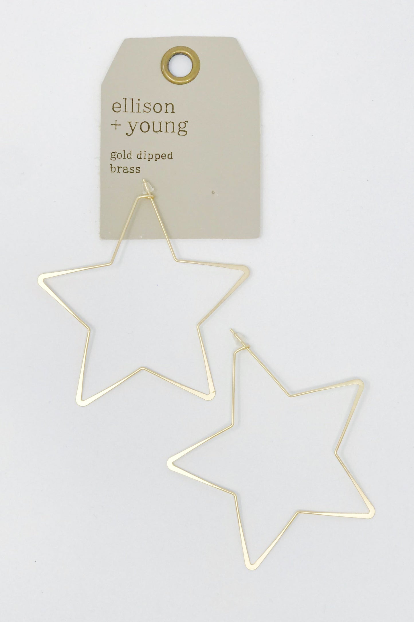 Large star hoop earrings from online Jewelry Boutique Ellison + Young shown in packaging