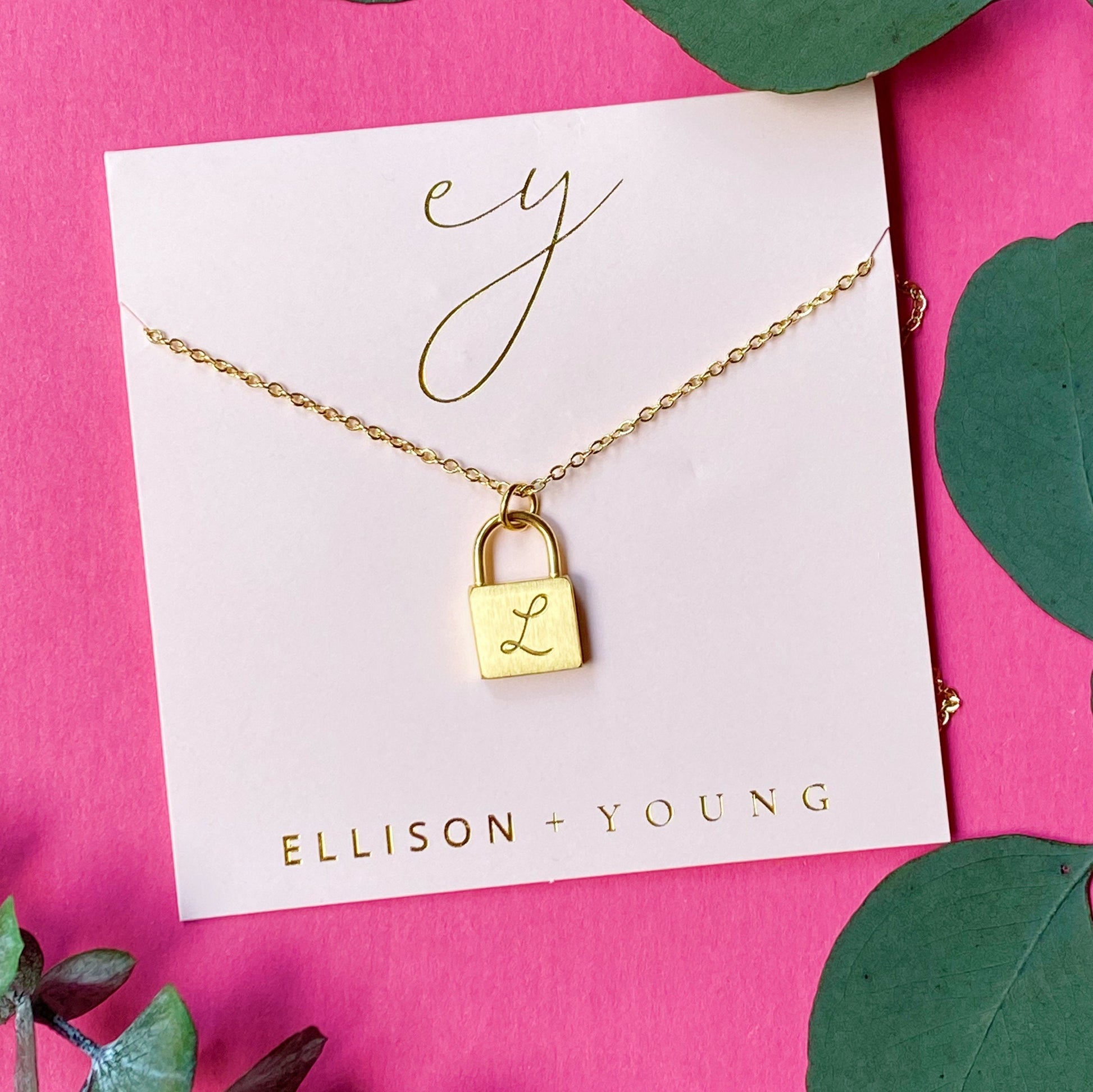 A 'L' initial necklace shown 