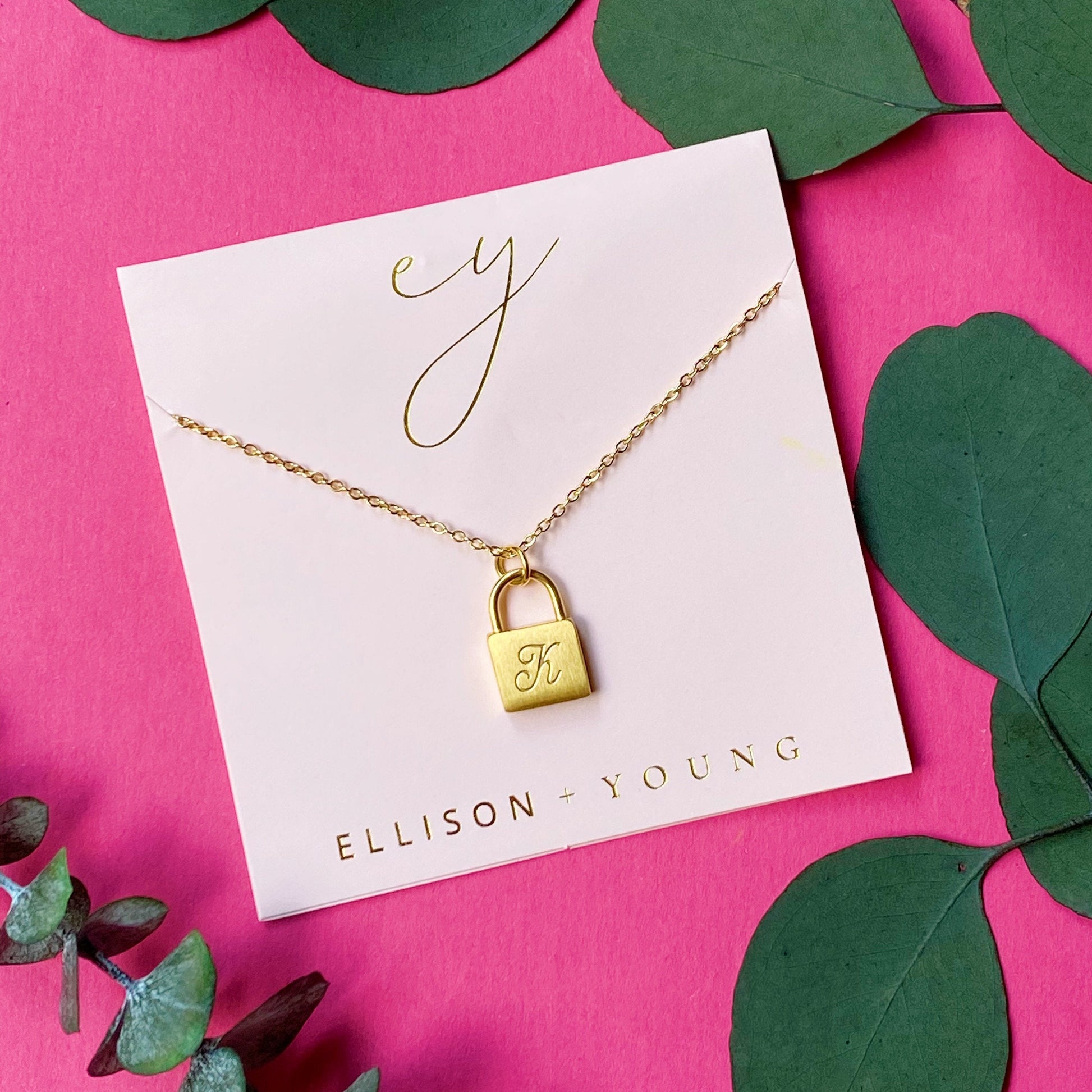 A 'K' initial necklace shown 