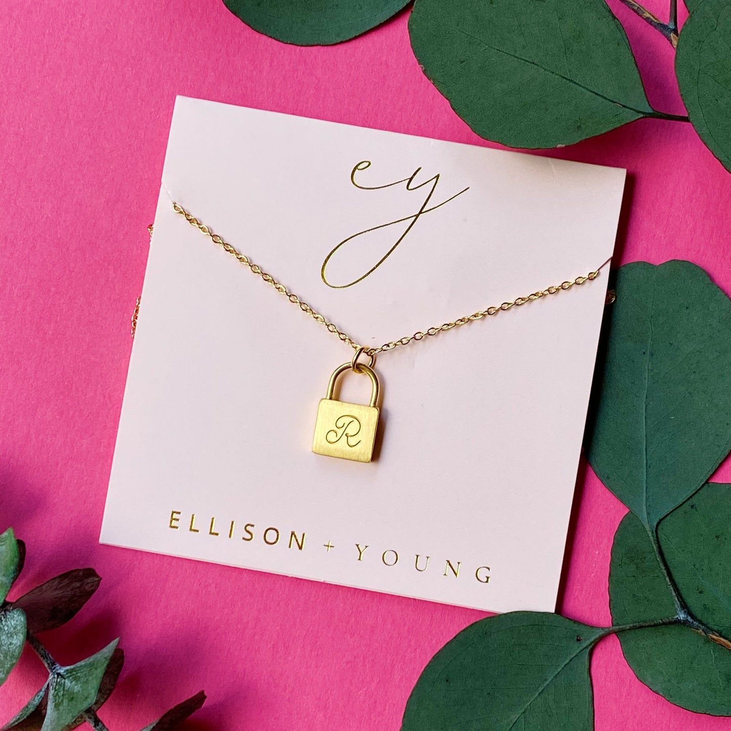 A 'R' initial necklace shown 