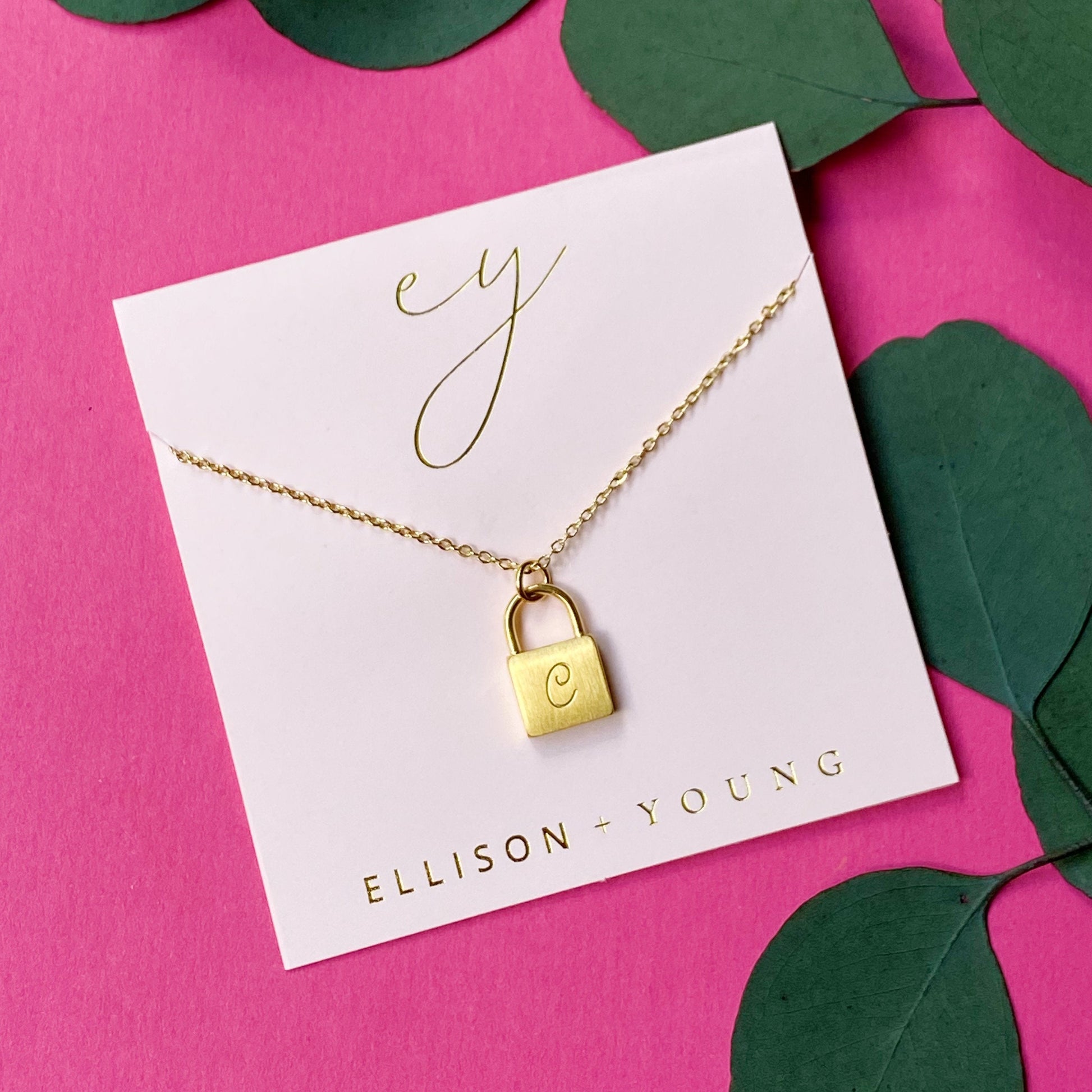 A 'C' initial necklace shown 