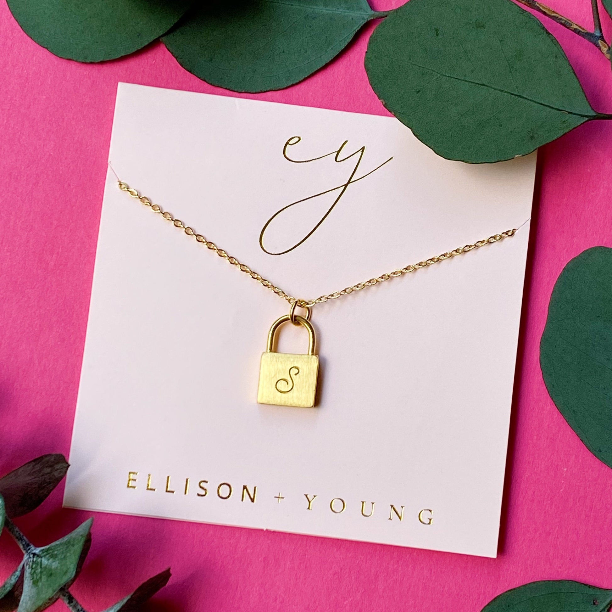 A 'S' initial necklace shown 