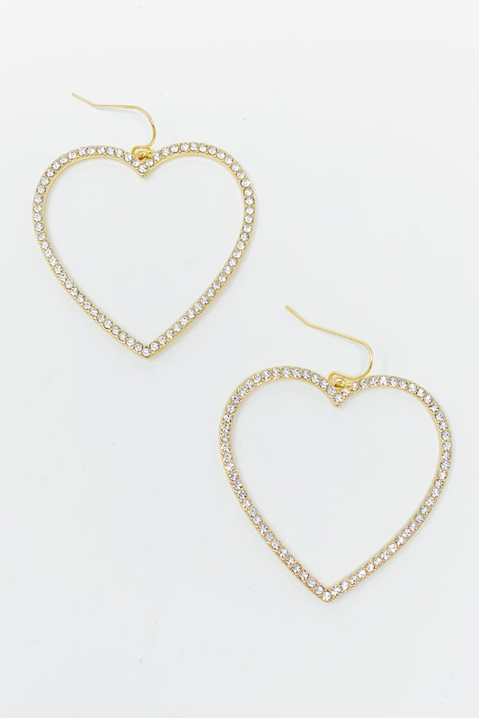 gold dangling heart hoop earrings displayed on white background
