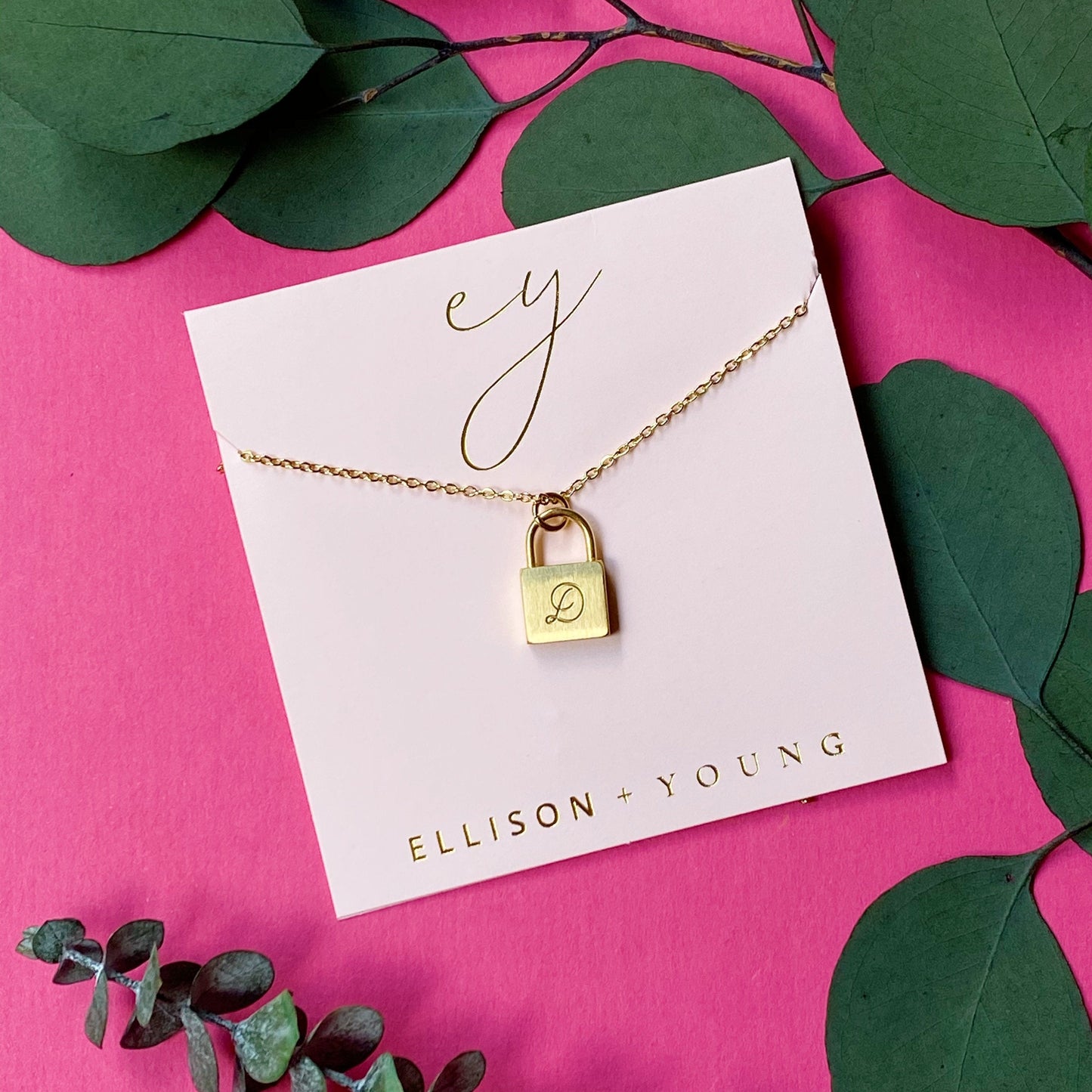 A 'D' initial necklace shown 